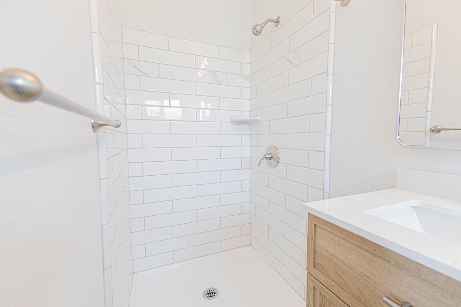 852 West San Gabriel Avenue Clovis, CA 93612 - Photo 14 of 16 a bathroom with a shower and a sink