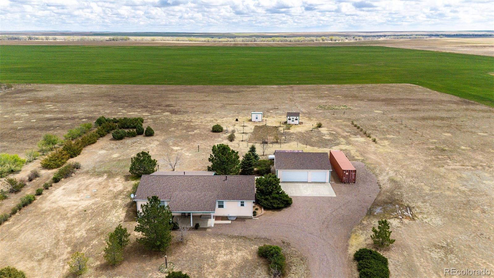 4420 Behrens Road Byers, CO 80103 - Photo 33 of 39 an aerial view of a house with a garden