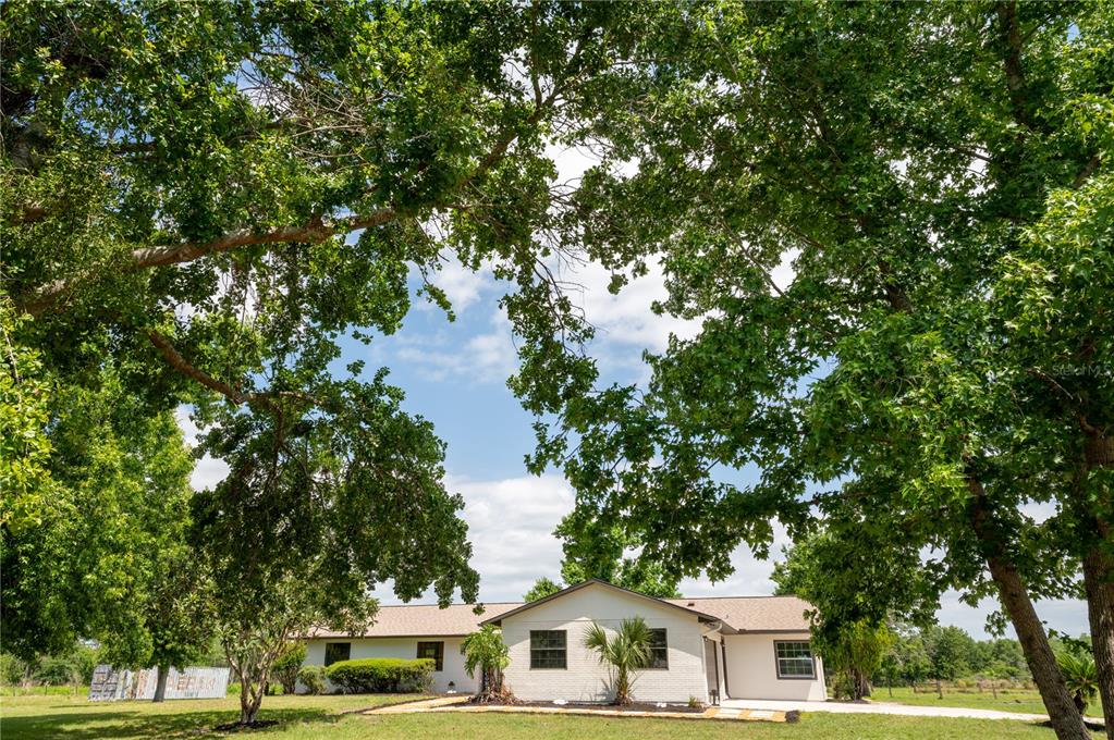 4225 Reaves Road Kissimmee, FL 34746 - Photo 1 of 1 a front view of a house with a garden