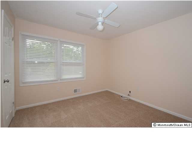 88 South New Prospect Road Jackson, NJ 08527 - Photo 10 of 17 a room with high traffic carpet with windows
