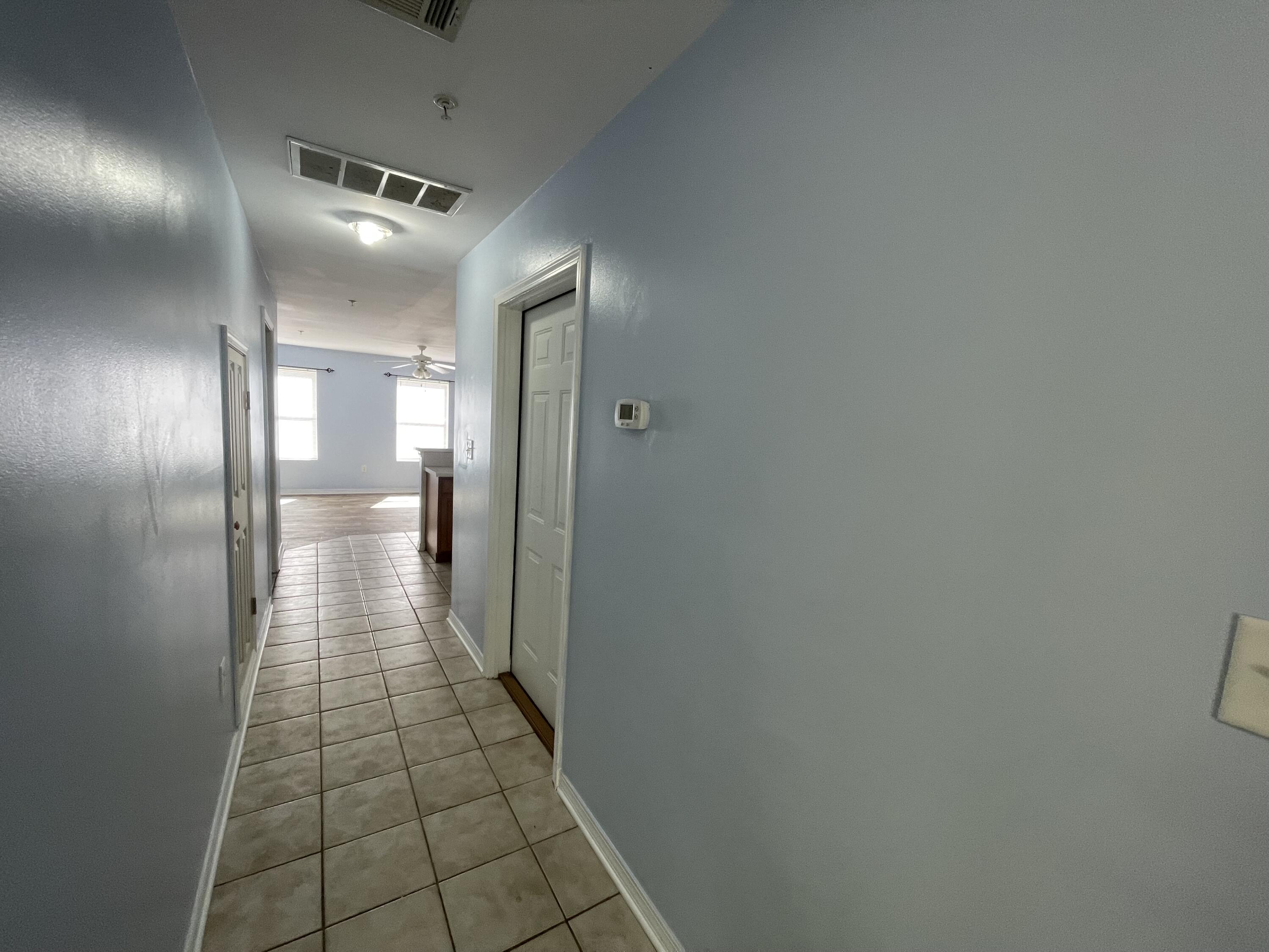 17 Shell Avenue Southeast, Unit B6 Fort Walton Beach, FL 32548 - Photo 2 of 11 a bathroom with a glass shower door