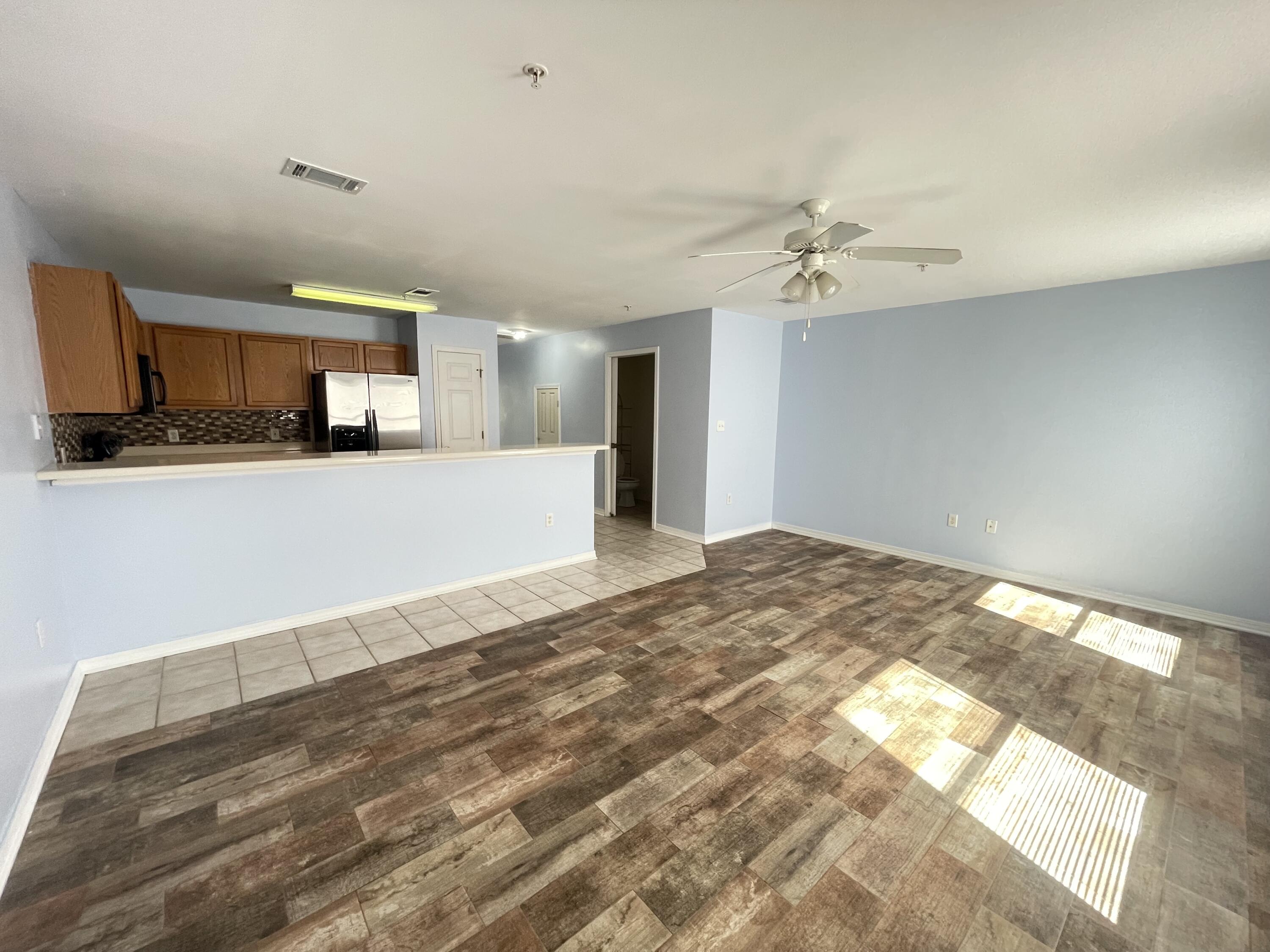 17 Shell Avenue Southeast, Unit B6 Fort Walton Beach, FL 32548 - Photo 3 of 11 a view of a kitchen with a sink and a refrigerator