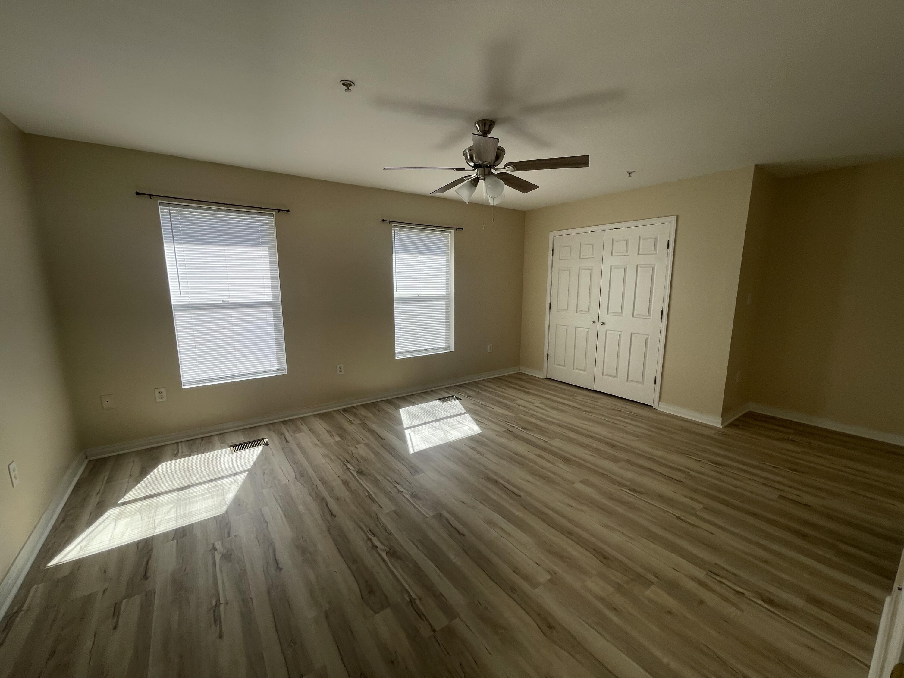 17 Shell Avenue Southeast, Unit B6 Fort Walton Beach, FL 32548 - Photo 5 of 11 a view of empty room with wooden floor and fan