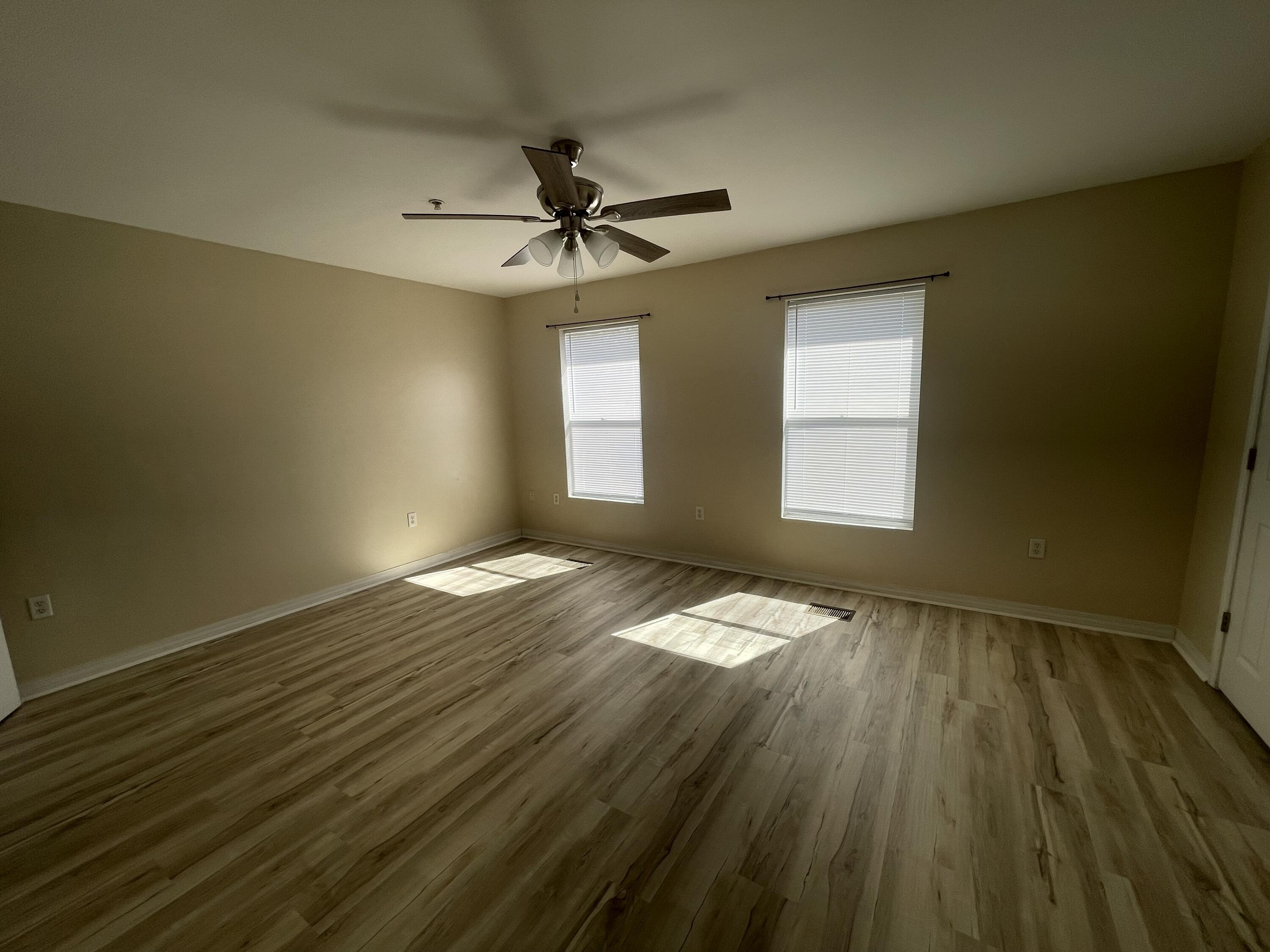 17 Shell Avenue Southeast, Unit B6 Fort Walton Beach, FL 32548 - Photo 7 of 11 a view of empty room with wooden floor and fan