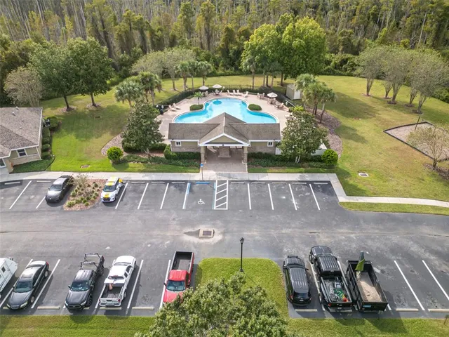 a view of a house with a yard and tree s