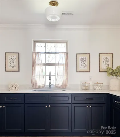 a bathroom with a sink and a window
