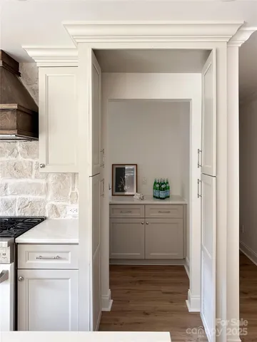 a kitchen with a refrigerator stove and microwave