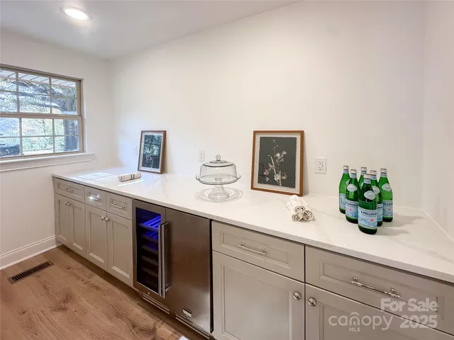 a spacious bathroom with a sink double vanity and mirror