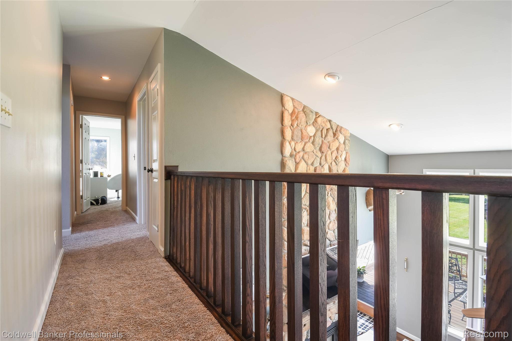 173 North Hayes Road Lapeer, MI 48446 - Photo 23 of 38 Upper walkway to bedrooms, overlooking railing balcony into Gr Room