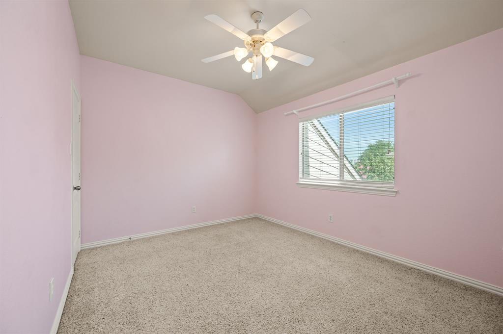 808 Briar Ridge Drive Keller, TX 76248 - Photo 29 of 40 Spacious room featuring neutral carpet, a single window with blinds, and an overhead ceiling fan with integrated lighting