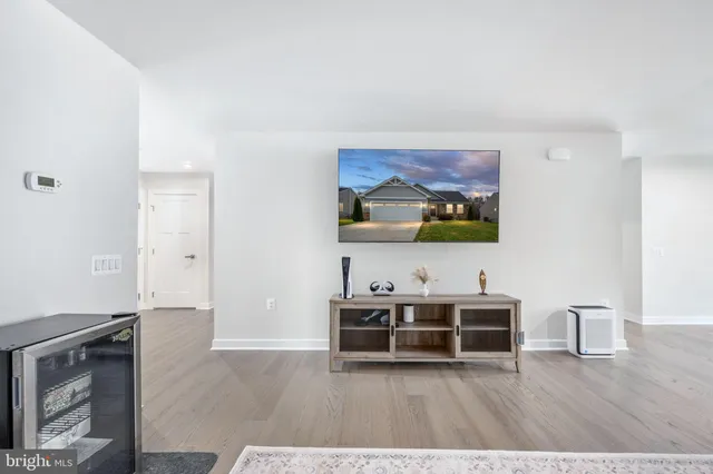 a view of a livingroom with furniture and wooden floor