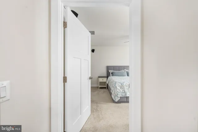 a bathroom with a sink and a bed
