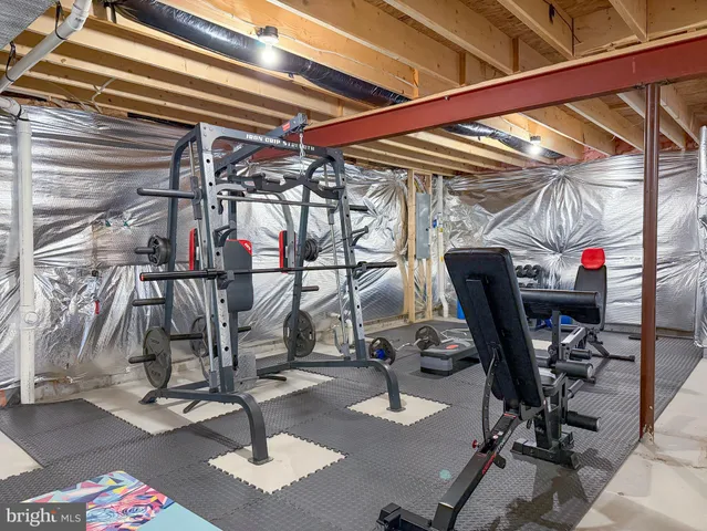a view of a house with a big yard and large trees