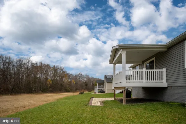 a view of a tennis ground with a large pool