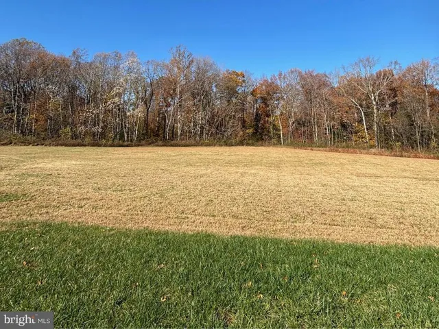 a view of a city with lawn chairs and a fountain