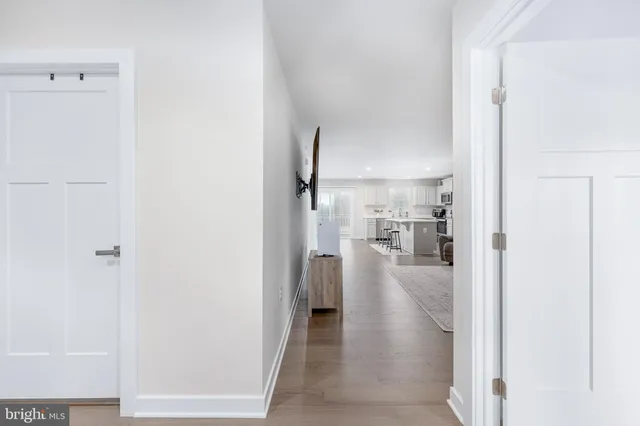 a kitchen with appliances a sink and cabinets