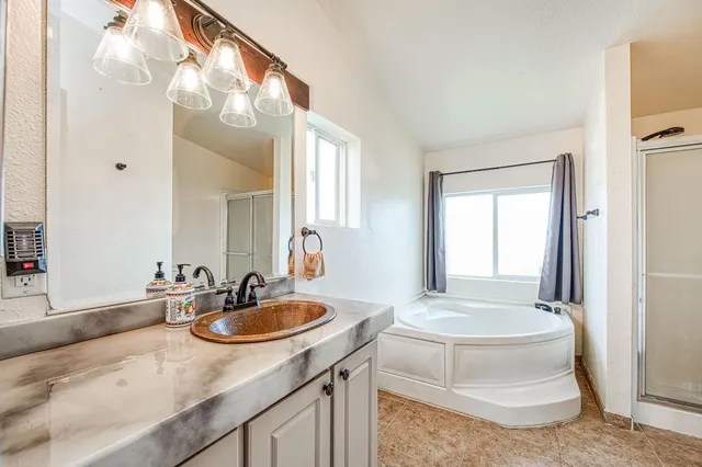 a bathroom with a bathtub and a shower