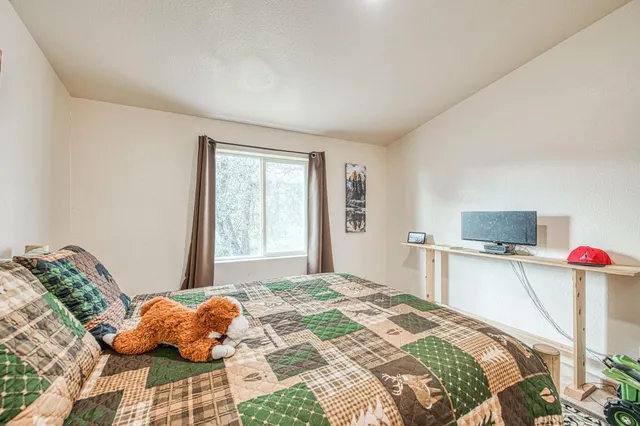 a view of a backyard with table and chairs