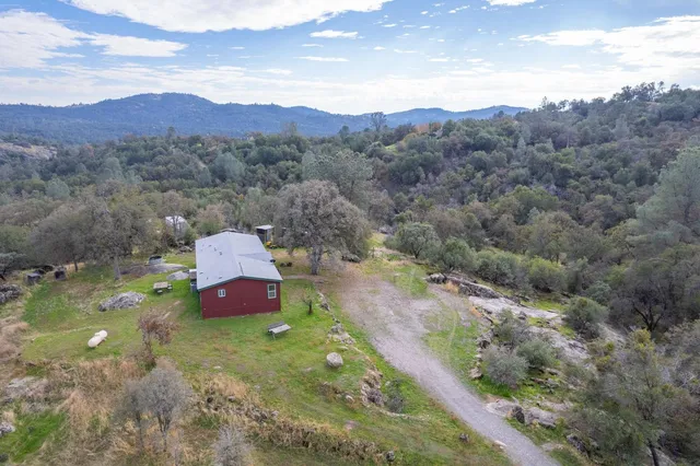 a aerial view of a house with a yard