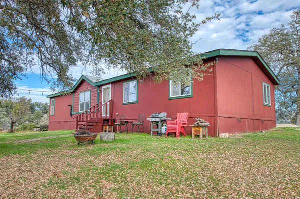a backyard of a house with lots of green space