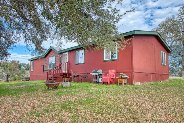 a backyard of a house with lots of green space
