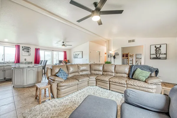 a living room with furniture and a large window