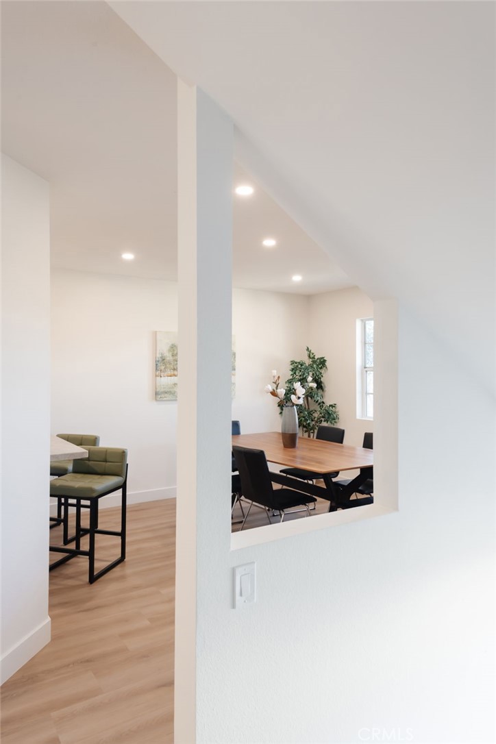 1044 252nd Street, Unit 4 Harbor City, CA 90710 - Photo 14 of 41 a view of a hallway with wooden floor and furniture