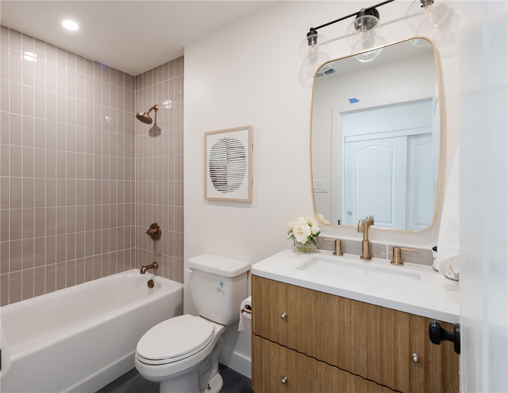 1044 252nd Street, Unit 4 Harbor City, CA 90710 - Photo 29 of 41 a bathroom with a sink a toilet and shower