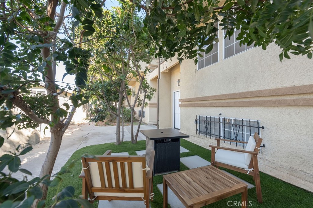 1044 252nd Street, Unit 4 Harbor City, CA 90710 - Photo 3 of 41 a view of a patio with iron fence