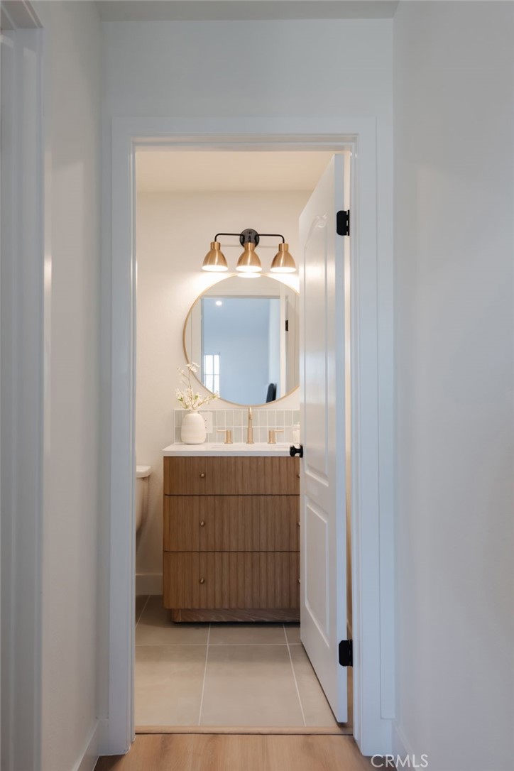 1044 252nd Street, Unit 4 Harbor City, CA 90710 - Photo 33 of 41 a bathroom with a sink vanity and mirror