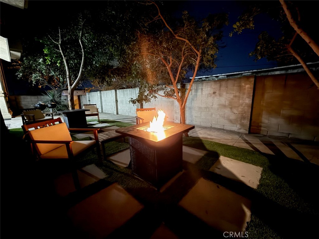1044 252nd Street, Unit 4 Harbor City, CA 90710 - Photo 40 of 41 a view of a couches and dinning table in patio