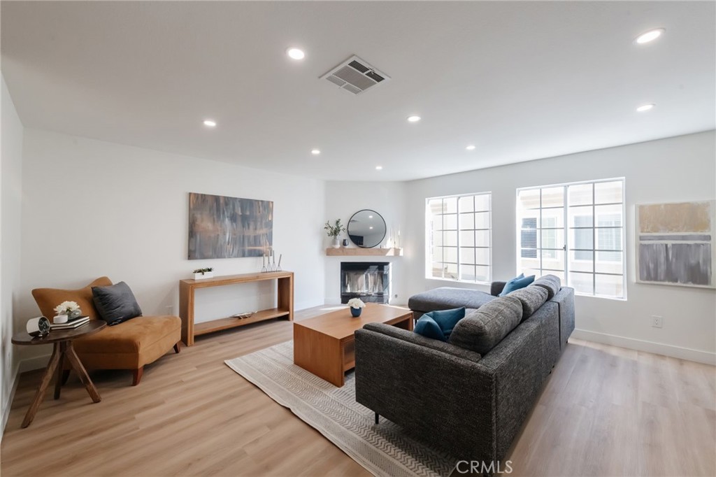 1044 252nd Street, Unit 4 Harbor City, CA 90710 - Photo 6 of 41 a living room with furniture and a window