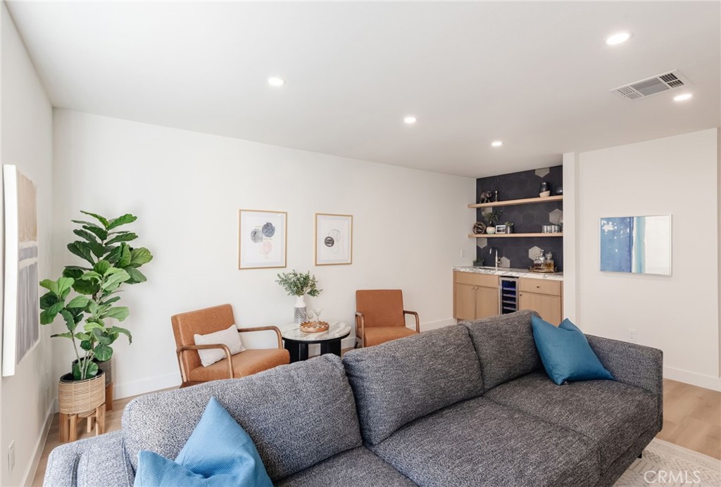 1044 252nd Street, Unit 4 Harbor City, CA 90710 - Photo 7 of 41 a living room with furniture and a potted plant