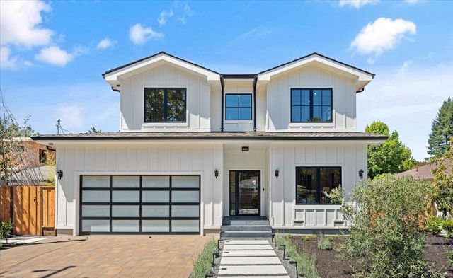 a front view of a house with a garage