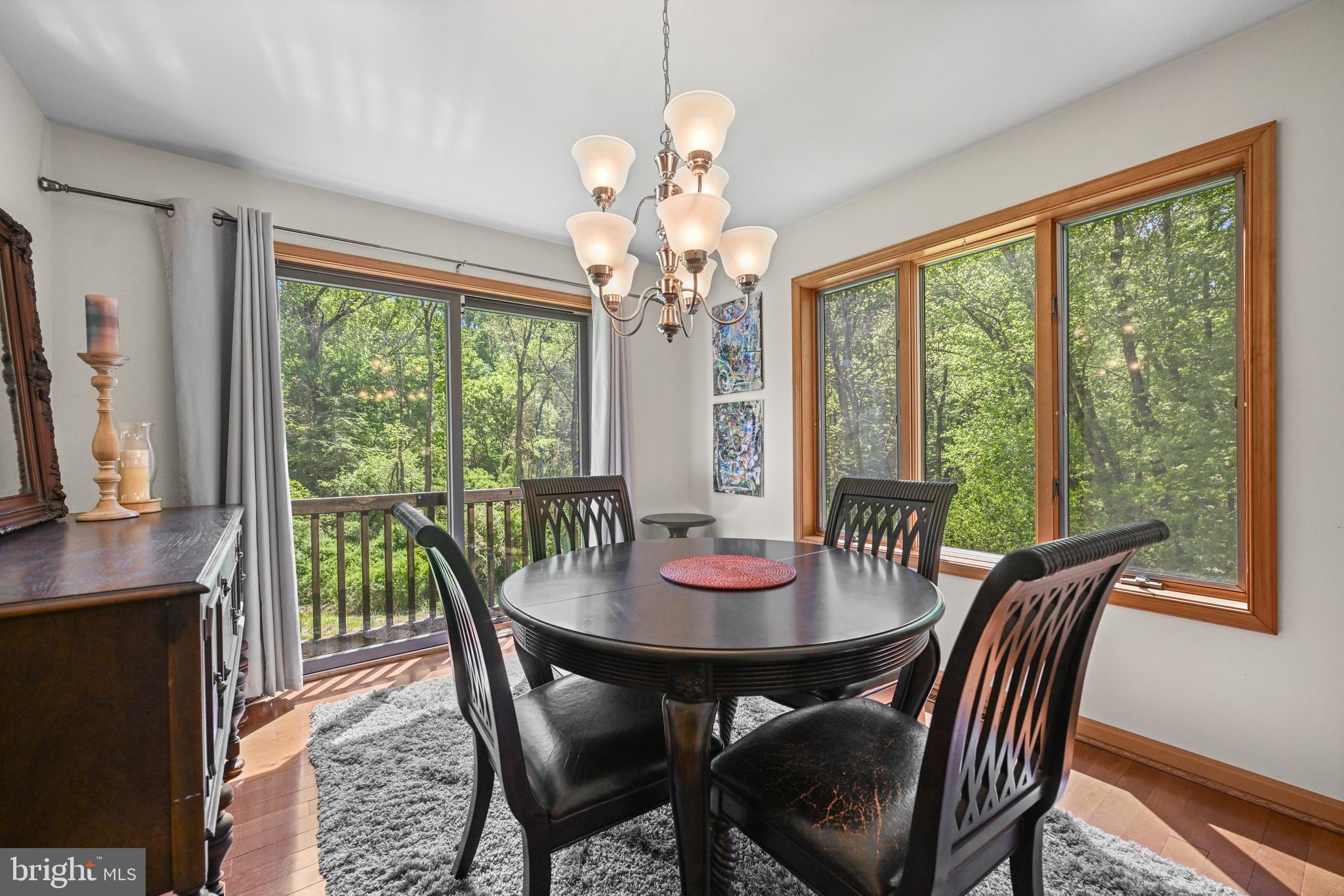 1680 East Street Road Kennett Square, PA 19348 - Photo 8 of 30 a view of a dining room with furniture a chandelier and wooden floor