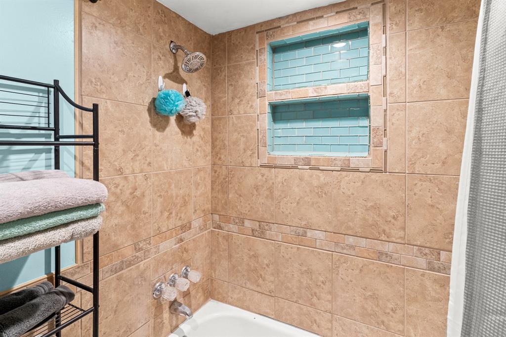 108 Paige Street Weatherford, TX 76088 - Photo 23 of 34 a bathroom with a sink and mirror