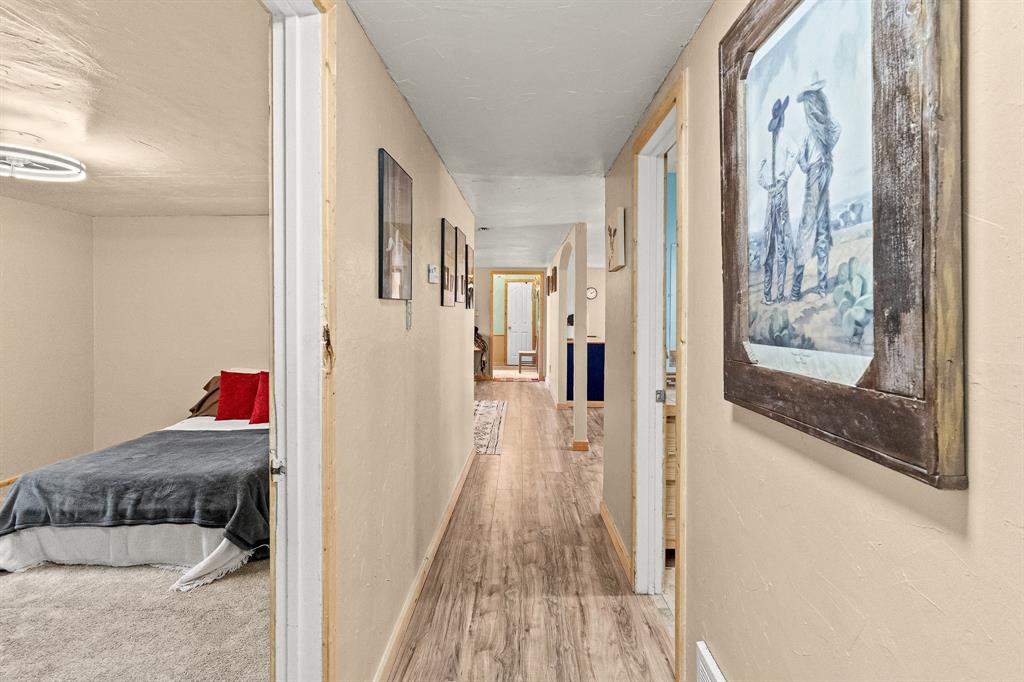 108 Paige Street Weatherford, TX 76088 - Photo 24 of 34 a view of a bedroom from a hallway