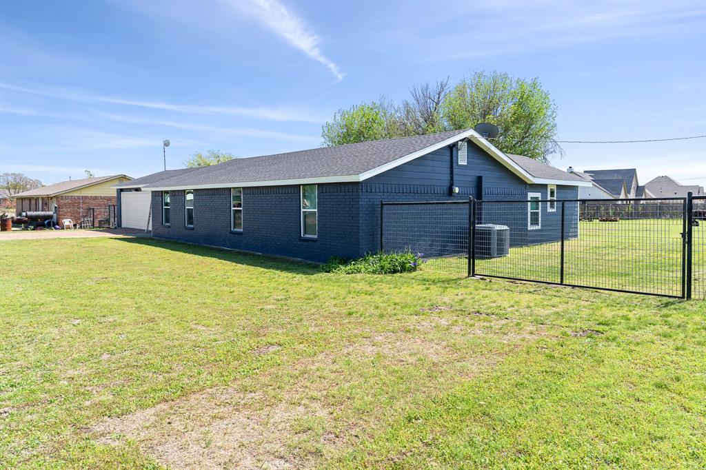 108 Paige Street Weatherford, TX 76088 - Photo 27 of 34 a view of a house with a yard