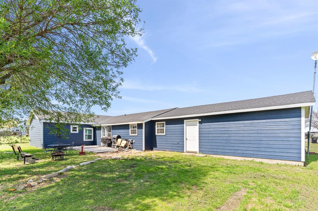 108 Paige Street Weatherford, TX 76088 - Photo 29 of 34 a front view of a house with a garden