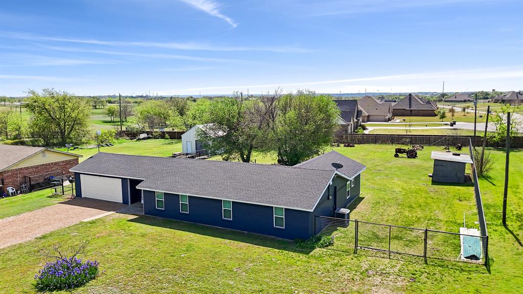 108 Paige Street Weatherford, TX 76088 - Photo 3 of 34 a aerial view of a house with swimming pool lawn chairs and iron fence