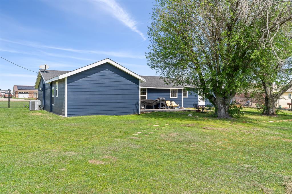 108 Paige Street Weatherford, TX 76088 - Photo 31 of 34 a view of a house with a backyard