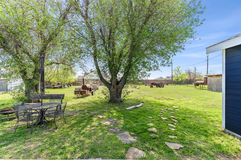 108 Paige Street Weatherford, TX 76088 - Photo 34 of 34 a view of backyard with outdoor seating and green space