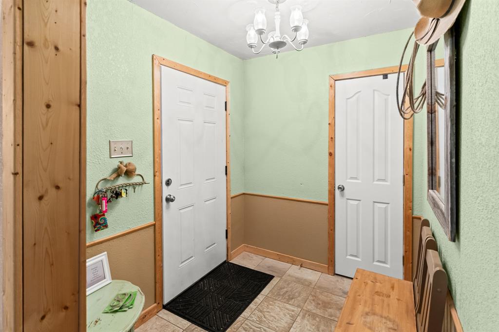 108 Paige Street Weatherford, TX 76088 - Photo 6 of 34 a view of a hallway with painted walls