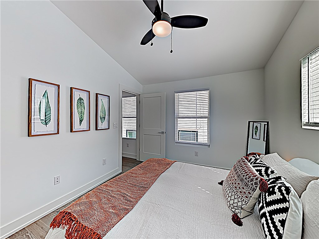 5314 Downs Drive, Unit A Austin, TX 78721 - Photo 10 of 19 a bedroom with a bed and a window