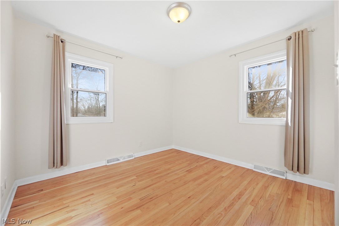 4003 Kenneth Road Stow, OH 44224 - Photo 32 of 50 Unfurnished room featuring light wood-style flooring and healthy amount of natural light