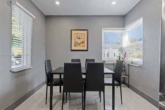a view of a dining room with furniture and window