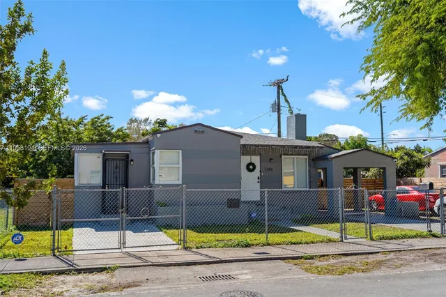 a front view of a house with swimming pool