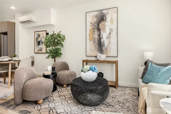 a living room with furniture and flowers