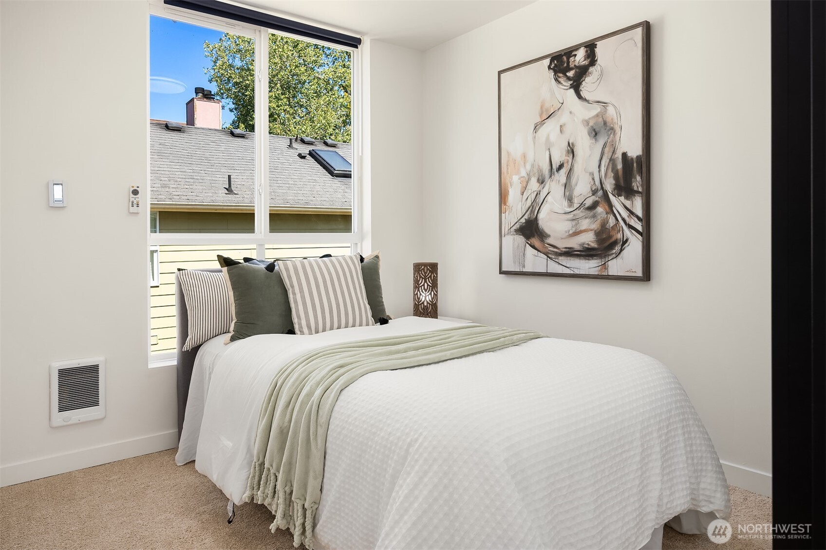 1402 North 95th Street Seattle, WA 98103 - Photo 14 of 31 a bedroom with bed and wall painting with large window