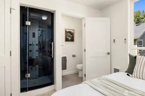 a bathroom with a shower and a toilet